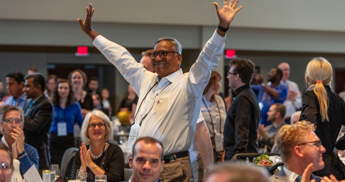 Man with hands raised in celebration